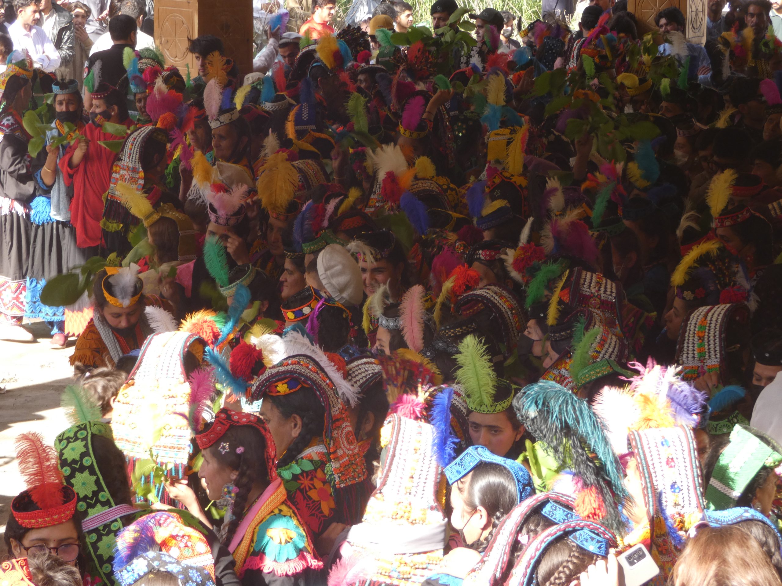 Chowmas - Kalash winter festival with traditional attire and dancing around bonfire